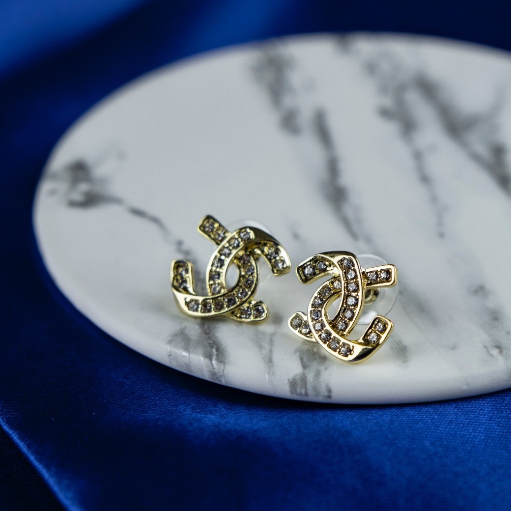 Unlocking Elegance: Exploring the Zircon Arc - A Deep Dive into C-Shaped Letter Two Superimposed Geometric Micro Set Studs