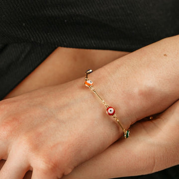 Fluttering Beauty: Embrace Your Animal Spirit with our Rose Gold Evil Eye Butterfly Dangle Charms Bracelet!