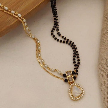Illuminate Your Christmas 2025 with Silver and Gold Layered Black Bead Necklace Patterns