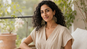 Zeya wearing Gold Semicircular Intricate Oxidized Indian Asian Boho Drop Ethnic Tribal Jhumka for Gold Jhumka Earrings Designs With Price: A Complete Guide | The Colourful Aura