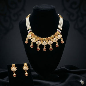 Kundan pearl choker necklace with matching earrings on velvet display — Indian wedding jewellery