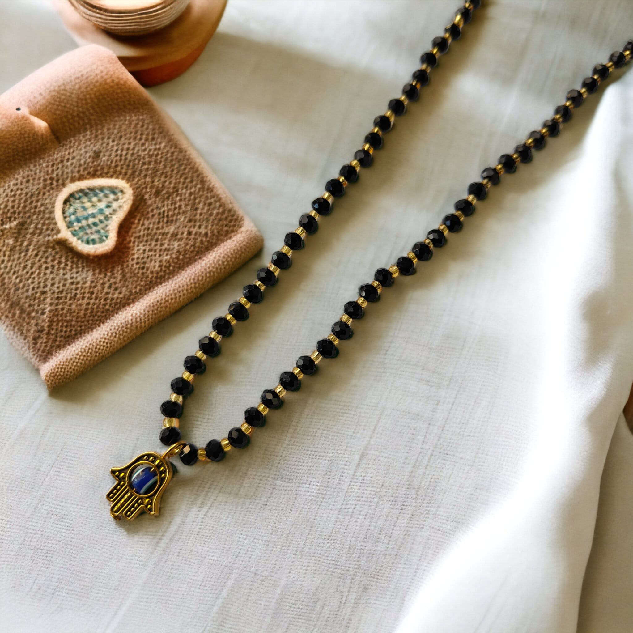 Beaded hamsa sale necklace