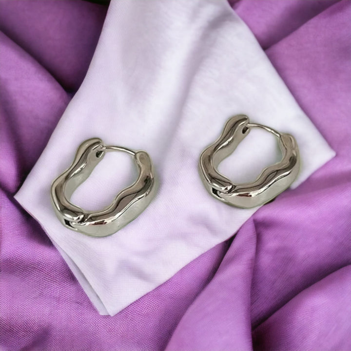 Silver Irregular Wave Shape Oval Large Metal Luxury Earlobe Hoop Earrings (Close-up Detail) | The Colourful Aura