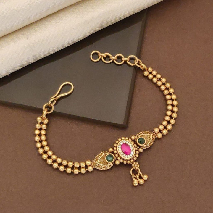 Traditional Brass Bracelet with Pink Stone Centerpiece