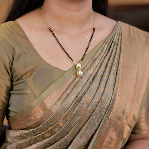 Elegant Twin-Pendant Gold Plated Zircon Mangalsutra Necklace (Close-up Detail) | The Colourful Aura
