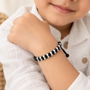 Adjustable Black and White Nazaria Bracelet for Kids (Close-up Detail) | The Colourful Aura