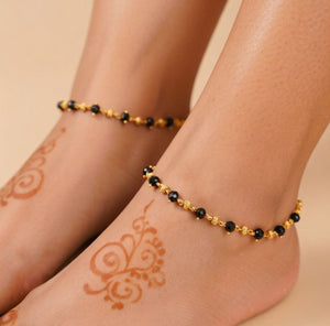 Black bead gold Nazaria anklet pair flat lay 18k gold plated brass tarnish free 9.5 inch The Colourful Aura