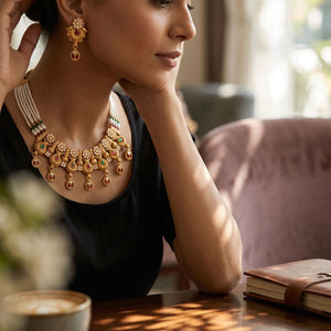 Gold antique kundan paisley choker necklace set worn by model in lifestyle setting — Indian bridal jewellery UK