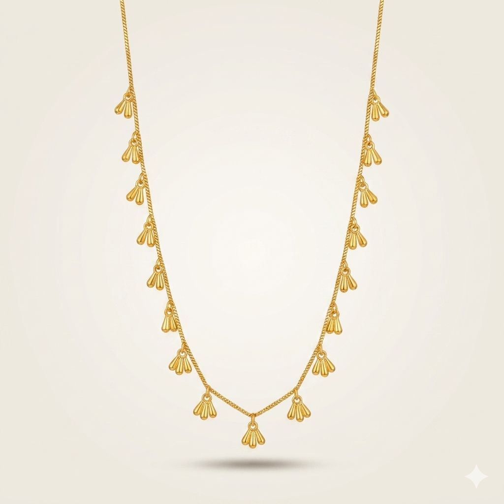 Gold fan charm drop necklace full length product shot — everyday jewellery UK
