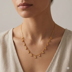 Dainty gold fan charm drop necklace worn by model — boho chain necklace UK

