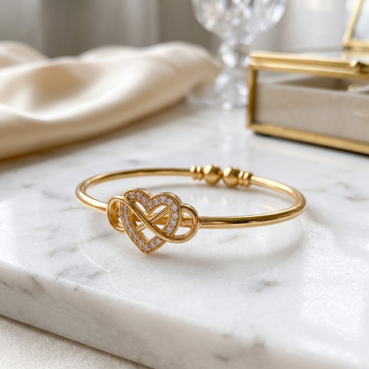 Gold Infinity Heart Bangle Bracelet (Close-up Detail) | The Colourful Aura