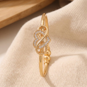 Gold Infinity Heart Bangle Bracelet (Close-up Detail) | The Colourful Aura
