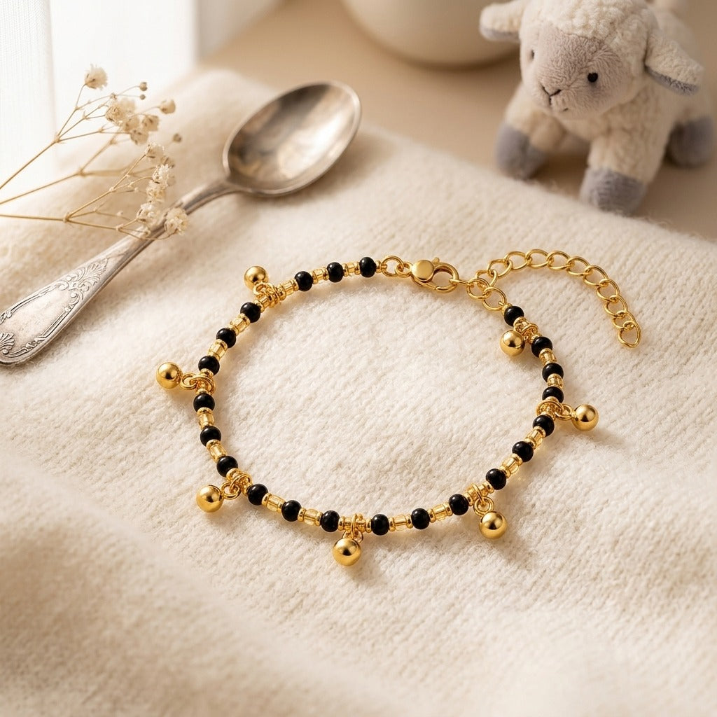 Gold Plated Black Bead Dangling Gold Ball Charm Kids Nazaria Bracelet (Close-up Detail) | The Colourful Aura