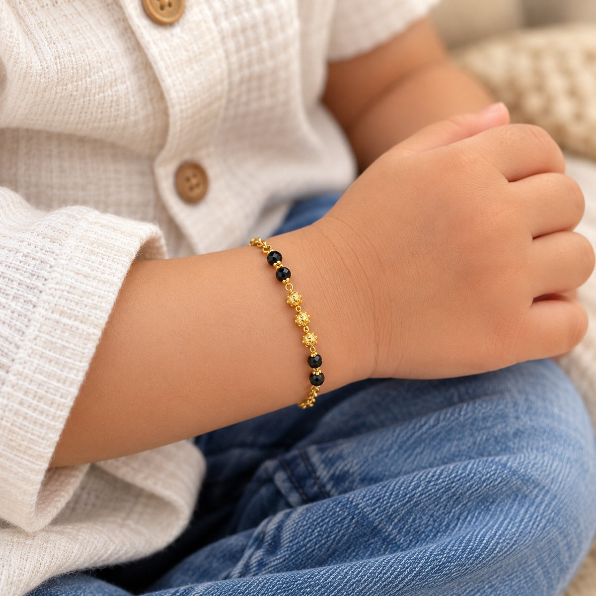 Gold Plated Black Crystal Bead Dotted Gold Ball Kids Nazaria Bracelet (Close-up Detail) | The Colourful Aura