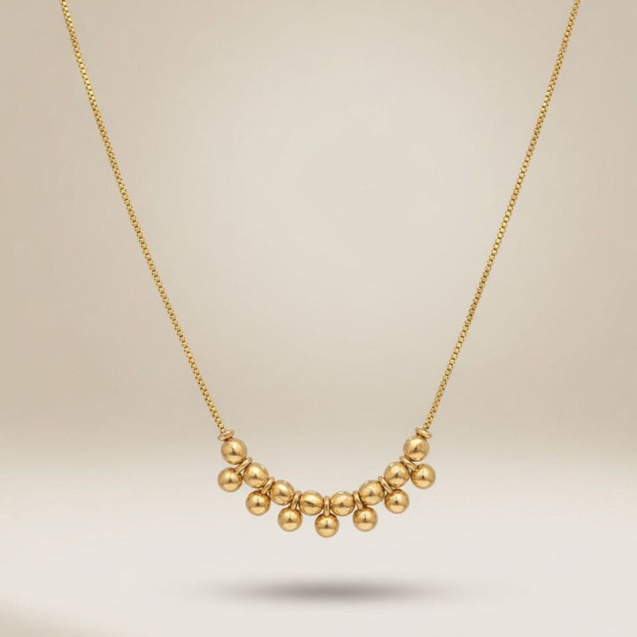 Gold plated cluster ball bead statement necklace flat lay product shot showing box chain