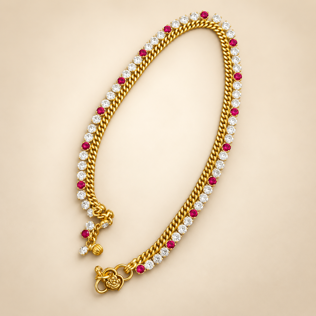 Gold plated red and clear crystal dangle charm payal anklet on beige background | The Colourful Aura
