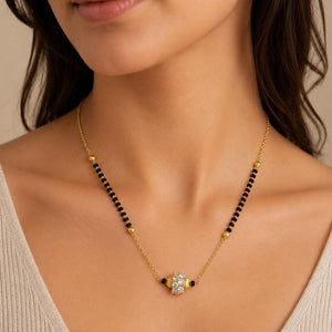 Gold plated mangalsutra necklace with black beads and CZ crystal pendant worn by model