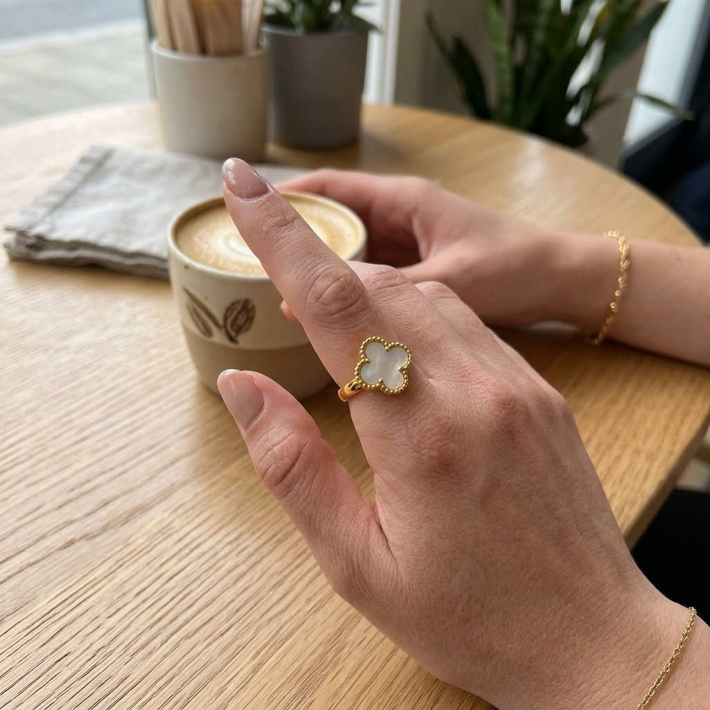 White Four Leaf Clover Adjustable Ring Worn on Finger (Close-up Detail) | The Colourful Aura