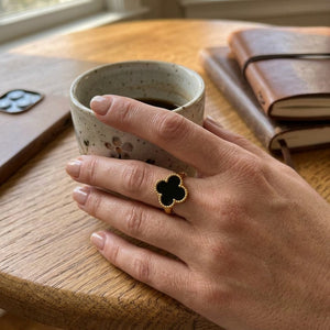 Black Four Leaf Clover Adjustable Ring Worn on Finger (Close-up Detail) | The Colourful Aura