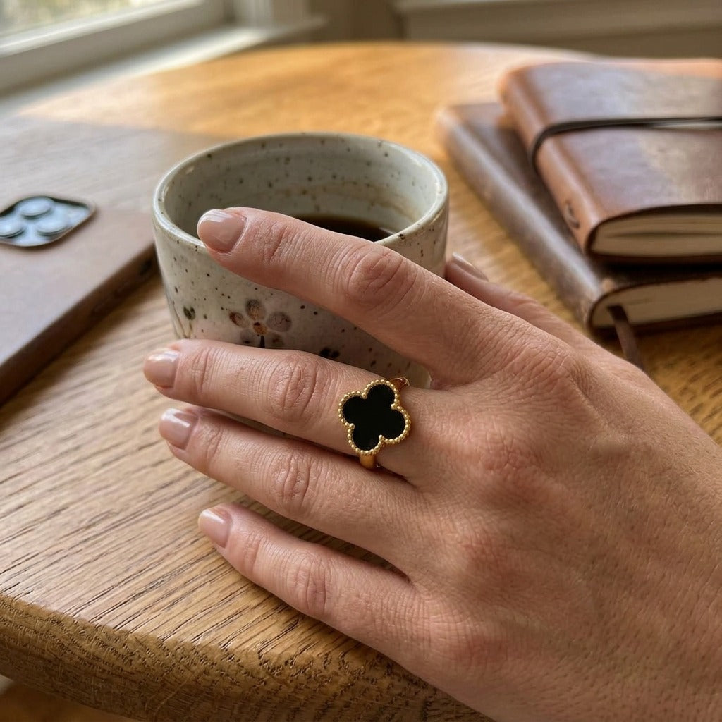 Black Four Leaf Clover Adjustable Ring Worn on Finger (Close-up Detail) | The Colourful Aura