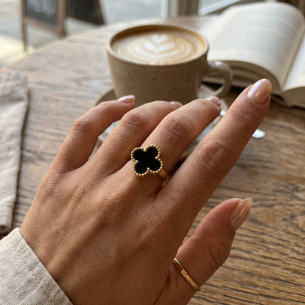 Black Four Leaf Clover Adjustable Ring Worn on Hand (Close-up Detail) | The Colourful Aura
