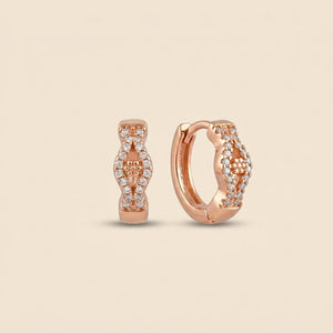 Rose gold crystal huggie hoop earrings with floral CZ pave detail — everyday jewellery UK
