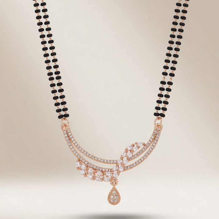 Rose gold plated double strand mangalsutra with CZ crystal marquise leaf pendant flat lay product shot
