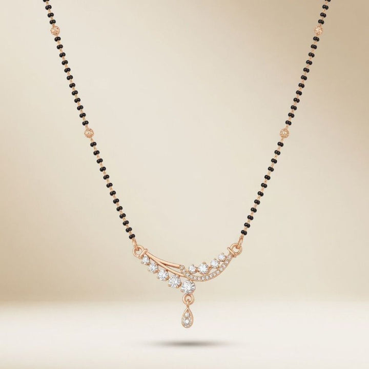 Rose gold plated mangalsutra with CZ crystal floral sweep pendant worn by model side view