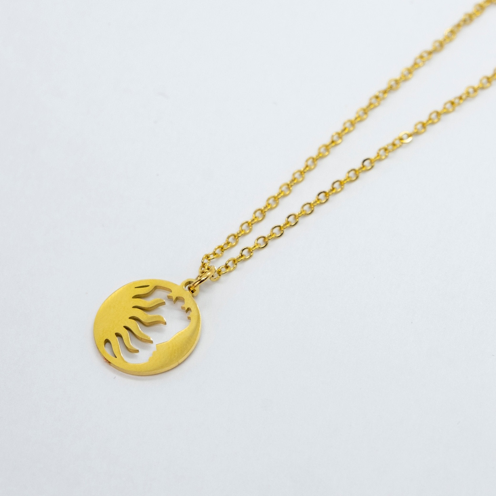 Small round gold pendant on sale necklace