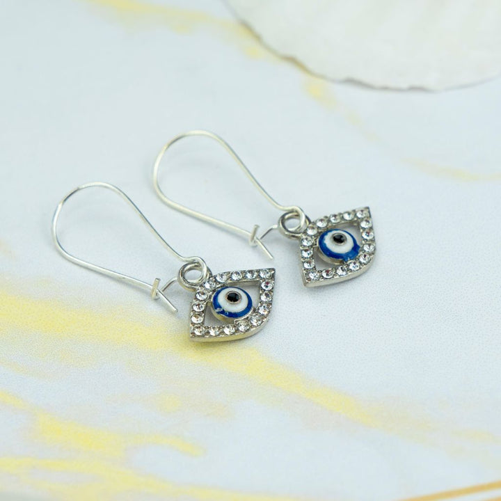 Long Silver Evil Eye Huggie Dainty Zircon Devil Eye Charm Latch Back Earrings (Close-up Detail) | The Colourful Aura