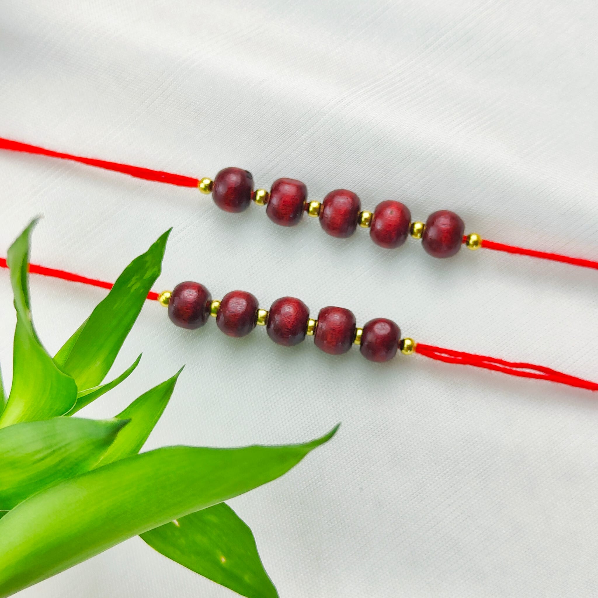 Plain Sandalwood Red Bead Hindu Festival Rakhi with Roli Chawal