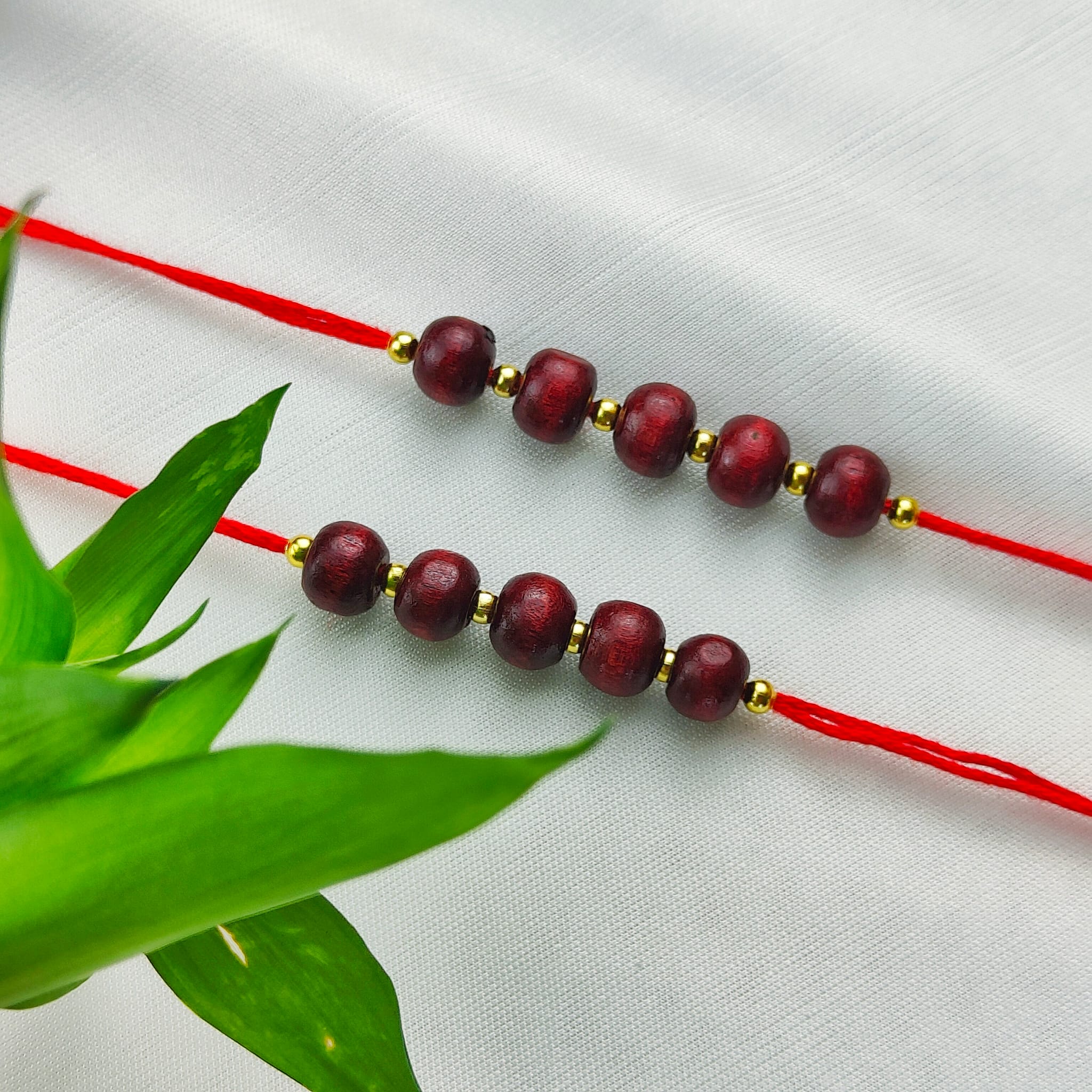 Plain Sandalwood Red Bead Hindu Festival Rakhi with Roli Chawal
