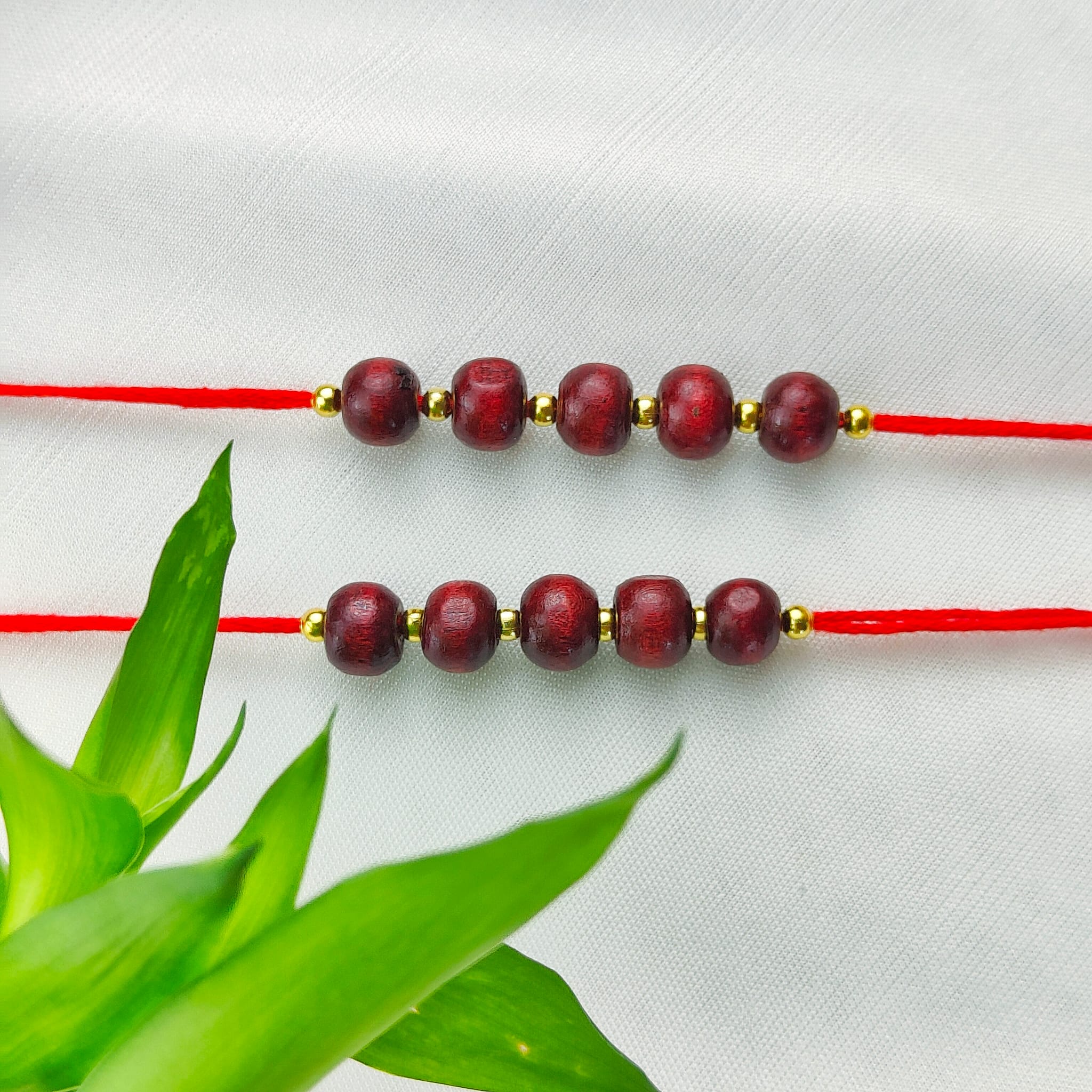Plain Sandalwood Red Bead Hindu Festival Rakhi with Roli Chawal