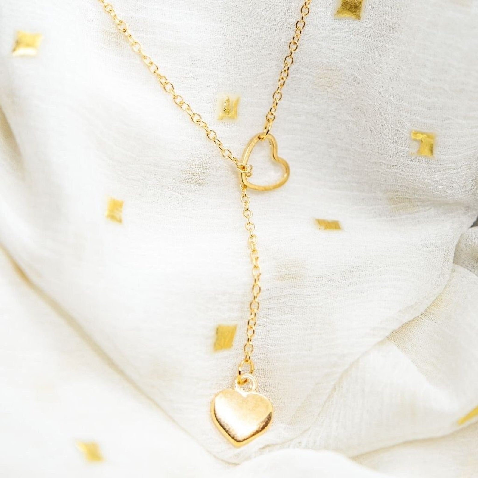 Two Heart Charm Cross Solid Heart Drop Interlock Y Shape Lariat Necklace (Close-up Detail) | The Colourful Aura